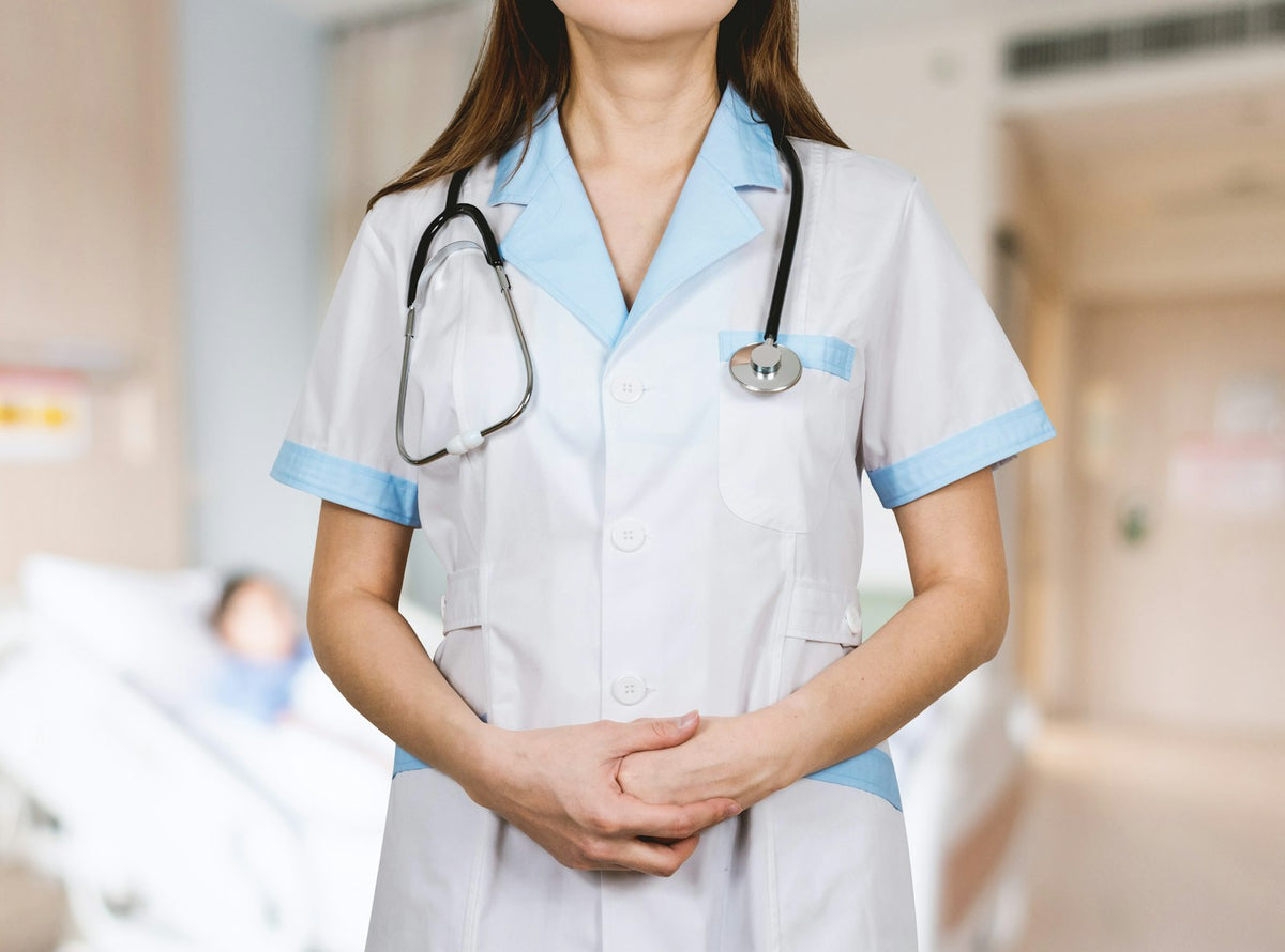 Nurse in white with a blue stethoscope