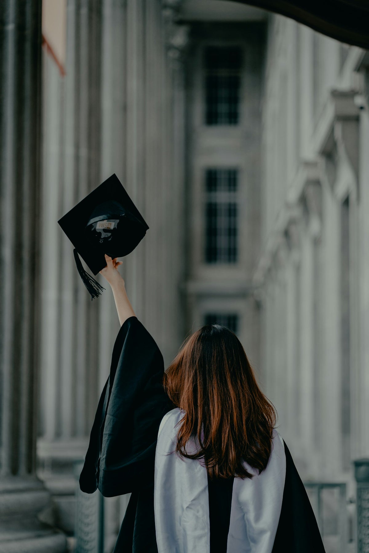 Graduate in a cap and gown